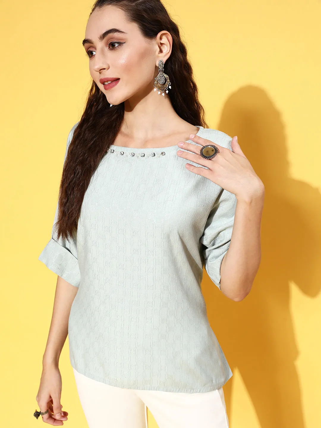 A Light Blue Color Self Weaved Embellished Top